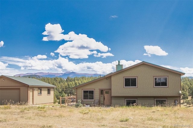 exterior space with a mountain view and a garage