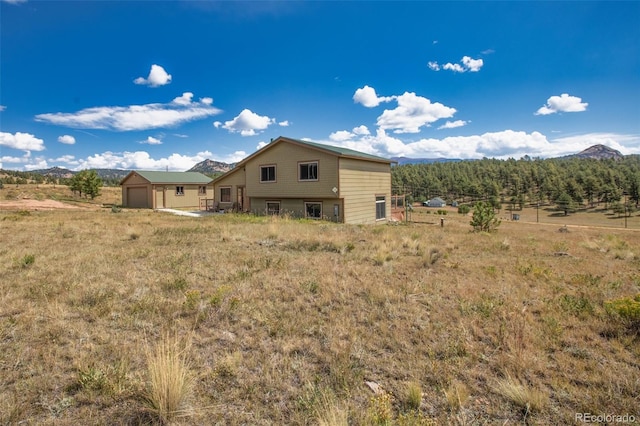 back of house featuring a mountain view