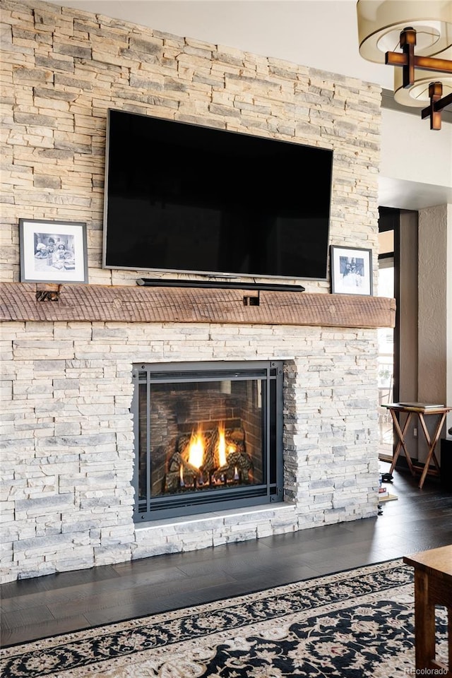 room details featuring wood finished floors and a fireplace