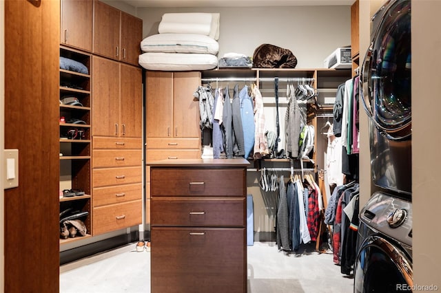 walk in closet featuring stacked washer and clothes dryer