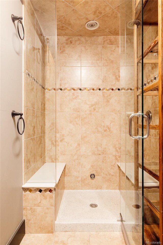 bathroom with a shower stall