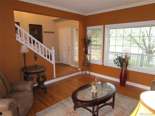 10522 Stoneflower Dr, Parker, CO 80134 - living area with wood finished floors, stairway, baseboards, and ornamental molding