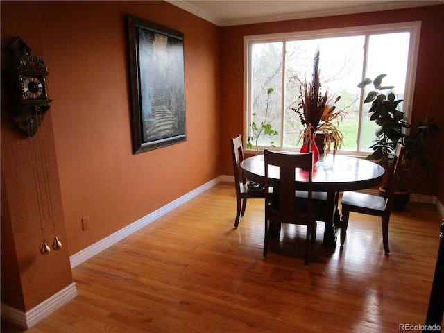 10522 Stoneflower Dr, Parker, CO 80134 - dining room with light wood-style flooring, ornamental molding, and baseboards
