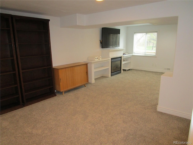 10522 Stoneflower Dr, Parker, CO 80134 - unfurnished living room with light carpet and baseboards