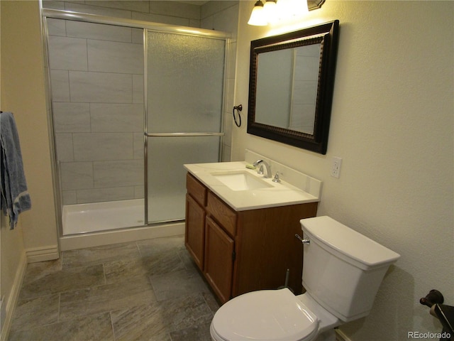 10522 Stoneflower Dr, Parker, CO 80134 - bathroom featuring toilet, a shower stall, and vanity