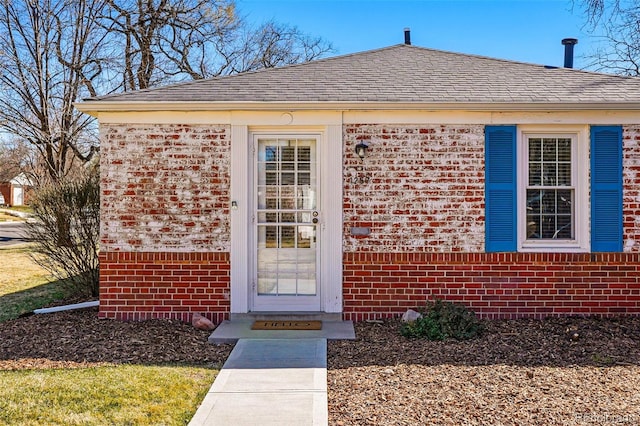 1257 Locust St, Denver, CO 80220 - doorway to property with brick siding and roof with shingles