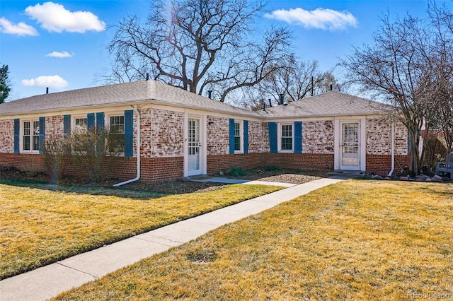 1257 Locust St, Denver, CO 80220 - view of front of property featuring brick siding and a front yard
