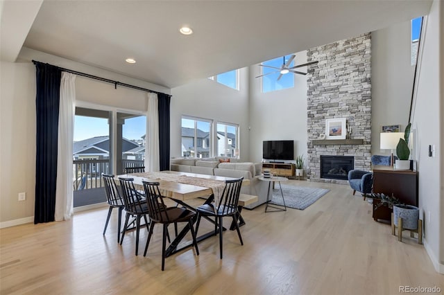 10024 Waterton Canyon Way, Colorado Springs, CO 80924 - dining space featuring ceiling fan, a fireplace, light wood-type flooring, recessed lighting, and baseboards