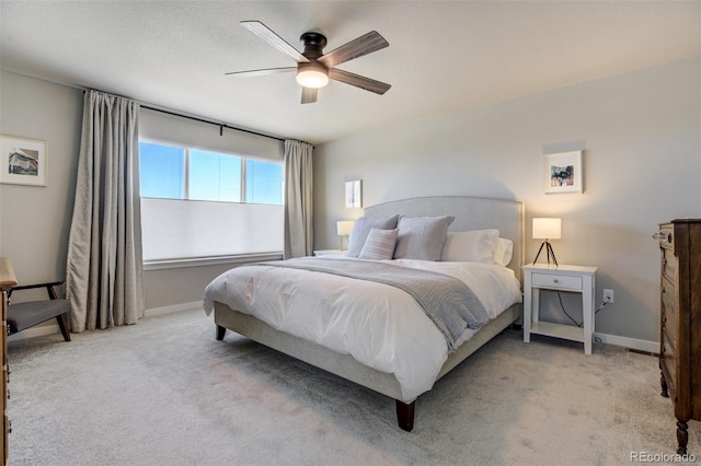 10024 Waterton Canyon Way, Colorado Springs, CO 80924 - bedroom with baseboards, a ceiling fan, and light colored carpet