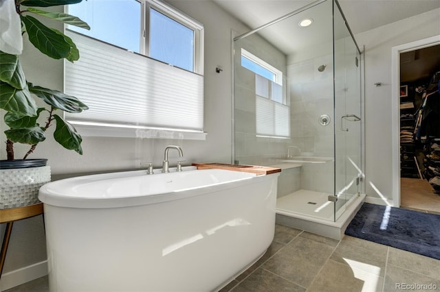 10024 Waterton Canyon Way, Colorado Springs, CO 80924 - full bath with a stall shower, tile patterned floors, a freestanding bath, and recessed lighting
