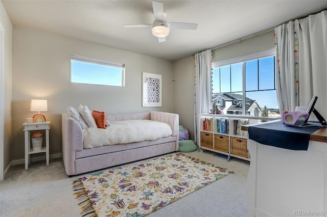 10024 Waterton Canyon Way, Colorado Springs, CO 80924 - carpeted bedroom featuring multiple windows and ceiling fan