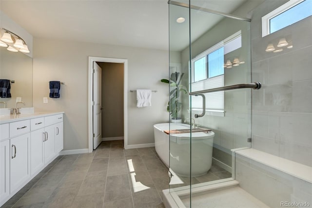 10024 Waterton Canyon Way, Colorado Springs, CO 80924 - bathroom featuring a shower stall, a freestanding tub, vanity, and plenty of natural light