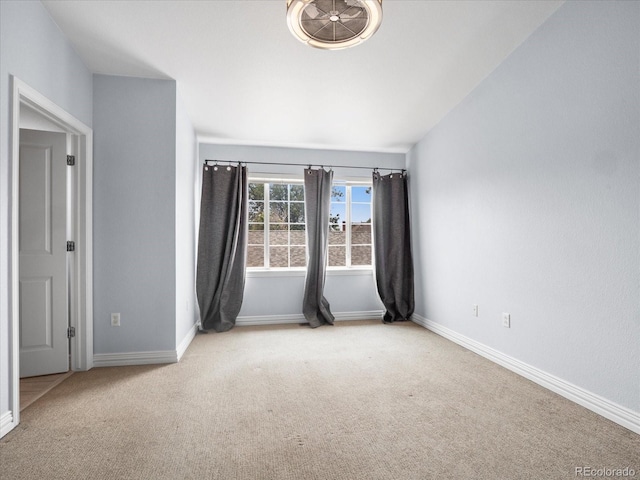 unfurnished room with light colored carpet