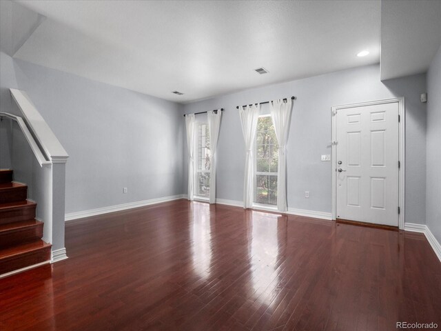 unfurnished living room with hardwood / wood-style flooring