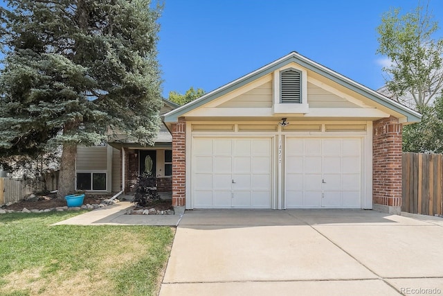 13317 Albion Cir, Thornton, CO 80241 - view of front of house featuring driveway, brick siding, and an attached garage