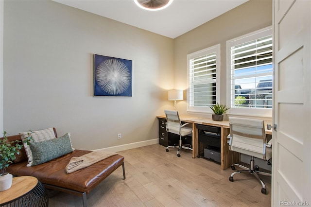 office with baseboards and light wood-type flooring