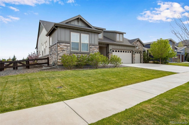 view of front facade featuring a front yard, driveway, an attached garage, and board and batten siding