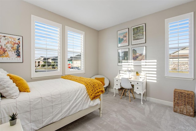 bedroom featuring carpet flooring and baseboards