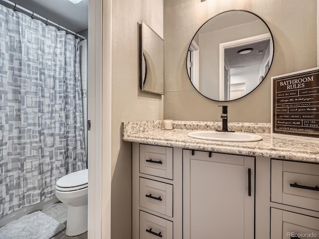 4068 S Atchison Way Unit 101, Aurora, CO 80014 - bathroom featuring vanity and curtained shower