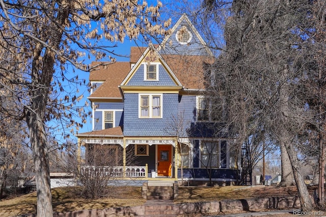 victorian-style house with a porch