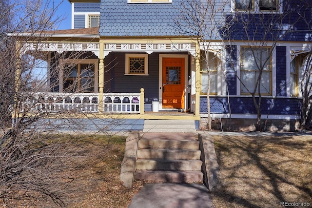 doorway to property featuring a porch