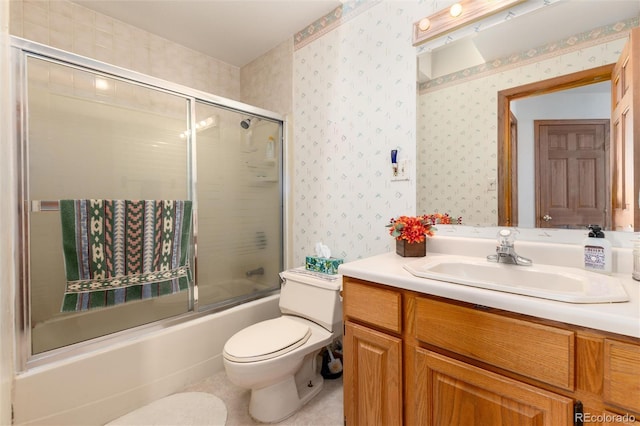 full bath with bath / shower combo with glass door, vanity, toilet, and wallpapered walls