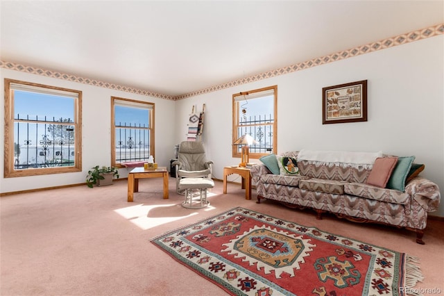 carpeted living room featuring baseboards