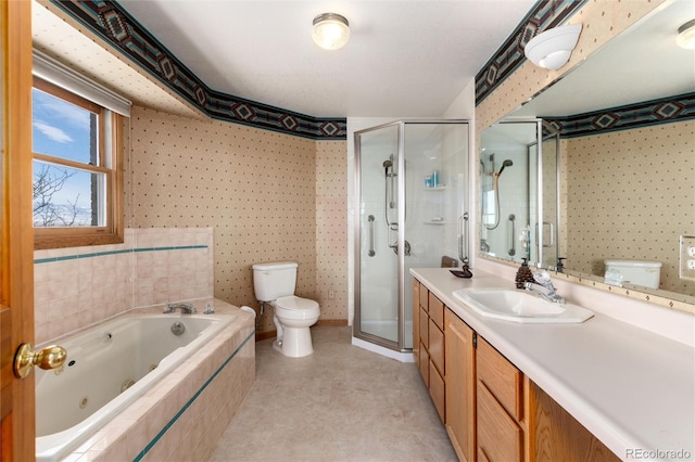full bath featuring a jetted tub, a shower stall, toilet, and vanity