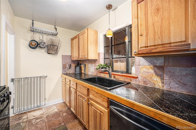 kitchen featuring tile countertops, a sink, dishwasher, tasteful backsplash, and stone tile flooring