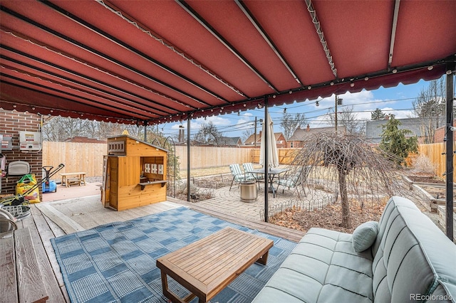 view of patio with a fenced backyard and outdoor dining area