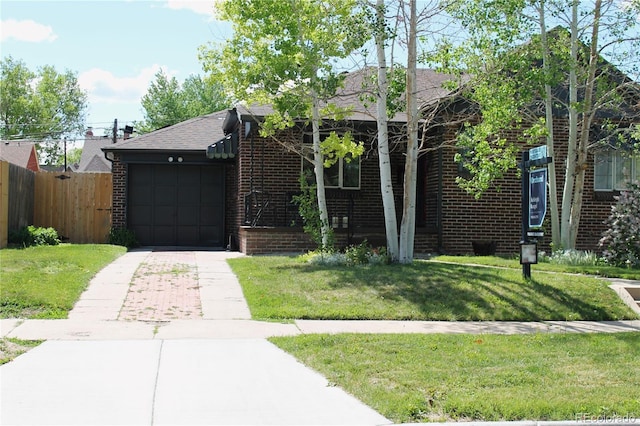1363 Stuart St, Denver, CO 80204 - view of front facade featuring brick siding, driveway, an attached garage, and a shingled roof