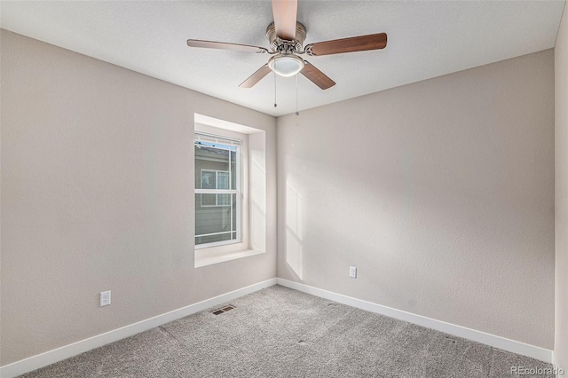 carpeted empty room with ceiling fan