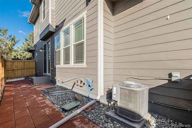 view of side of home featuring central AC unit and a patio area