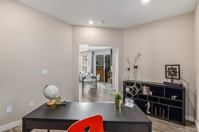 office with hardwood / wood-style flooring