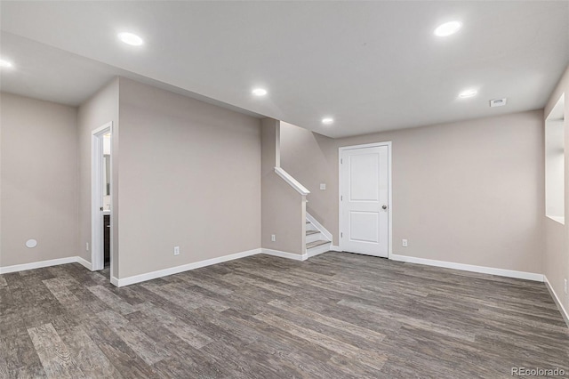 basement featuring dark hardwood / wood-style flooring