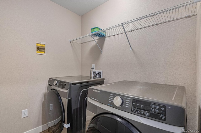 clothes washing area with independent washer and dryer