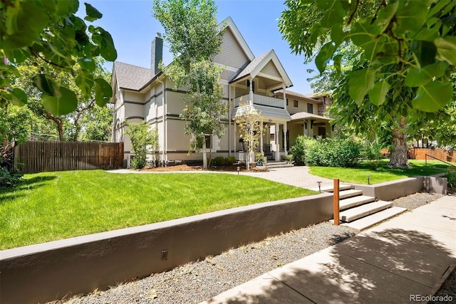 321 S Emerson St, Denver, CO 80209 - view of front of house with a balcony, a chimney, and roof with shingles