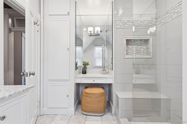 321 S Emerson St, Denver, CO 80209 - bathroom with vanity, a tile shower, and marble finish floors