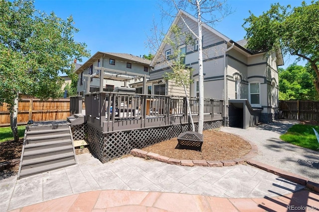 321 S Emerson St, Denver, CO 80209 - back of house with a deck and an outdoor fire pit