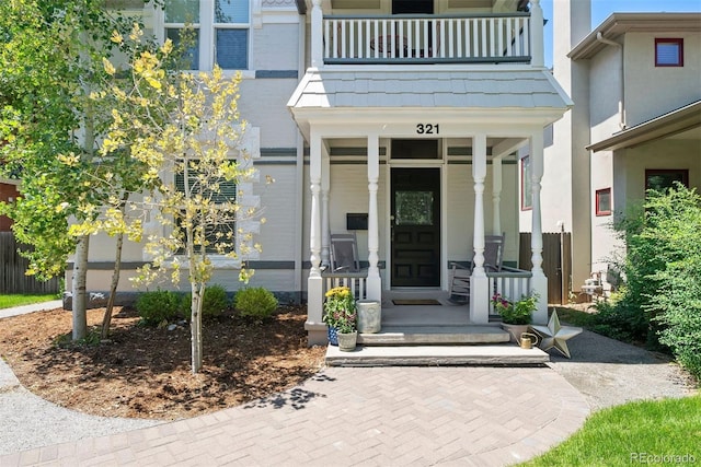321 S Emerson St, Denver, CO 80209 - doorway to property with a balcony and a porch