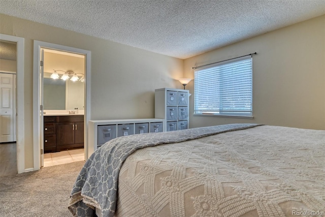 972 Columbine Ave, Colorado Springs, CO 80904 - carpeted bedroom featuring a textured ceiling and connected bathroom