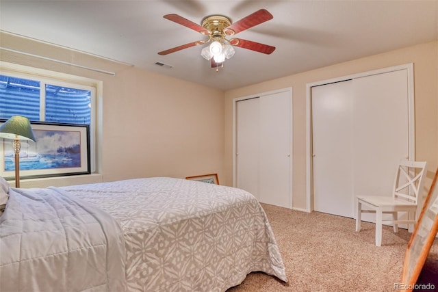 972 Columbine Ave, Colorado Springs, CO 80904 - carpeted bedroom with two closets and ceiling fan