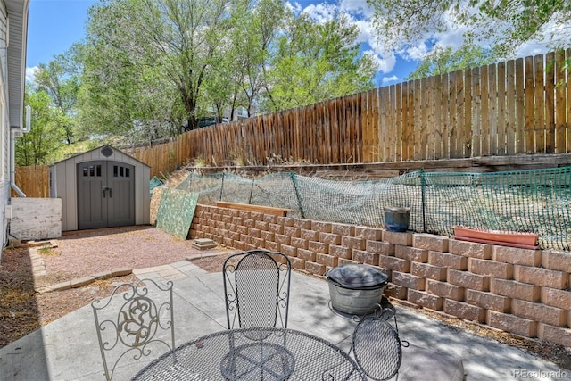 972 Columbine Ave, Colorado Springs, CO 80904 - fenced backyard featuring a storage unit, a patio, and outdoor dining space