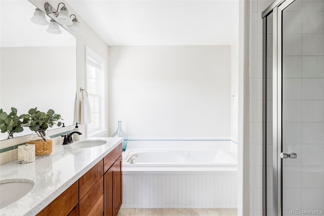 8739 E 23rd Ave, Denver, CO 80238 - bathroom with a garden tub, double vanity, and tiled shower