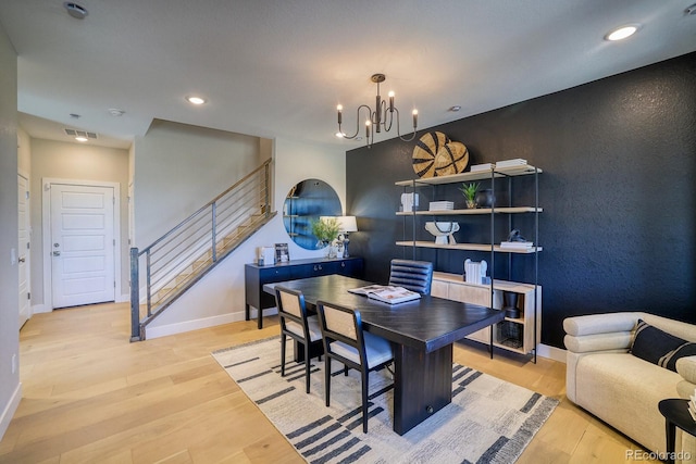 office space featuring a chandelier, wood finished floors, baseboards, and recessed lighting