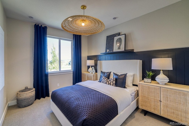 carpeted bedroom featuring baseboards