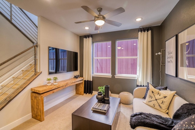 living area with carpet flooring, baseboards, ceiling fan, recessed lighting, and stairway