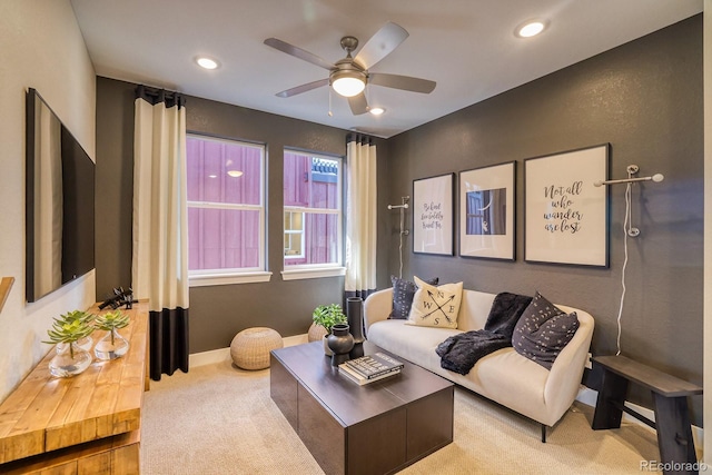 carpeted living area with ceiling fan, baseboards, and recessed lighting
