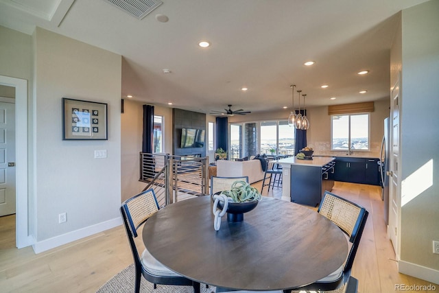 dining area featuring recessed lighting, light wood-type flooring, baseboards, and ceiling fan