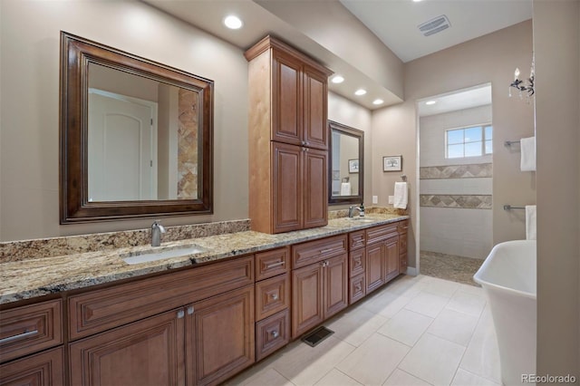 full bath with double vanity, visible vents, a sink, and recessed lighting